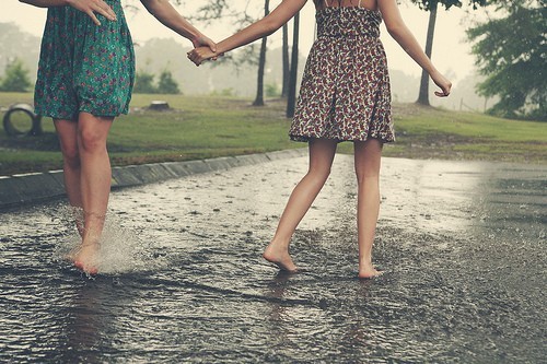 girls-playing-in-the-rain