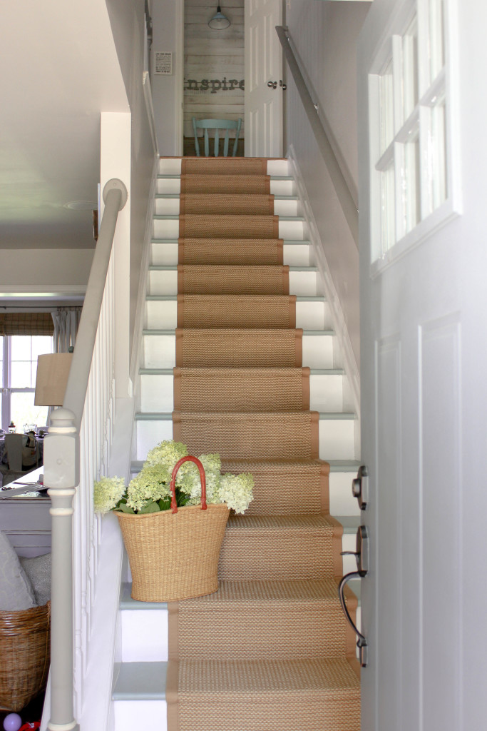 A stair runner make to look like sisal or natural fiber but holds up better to the elements