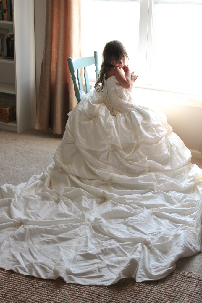 Let your daughter try on your wedding dress