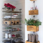 A-set-of-hanging-herb-crates-and-a-bakers-rack-hold-our-most-used-kitchen-necessities-within-easy-reach