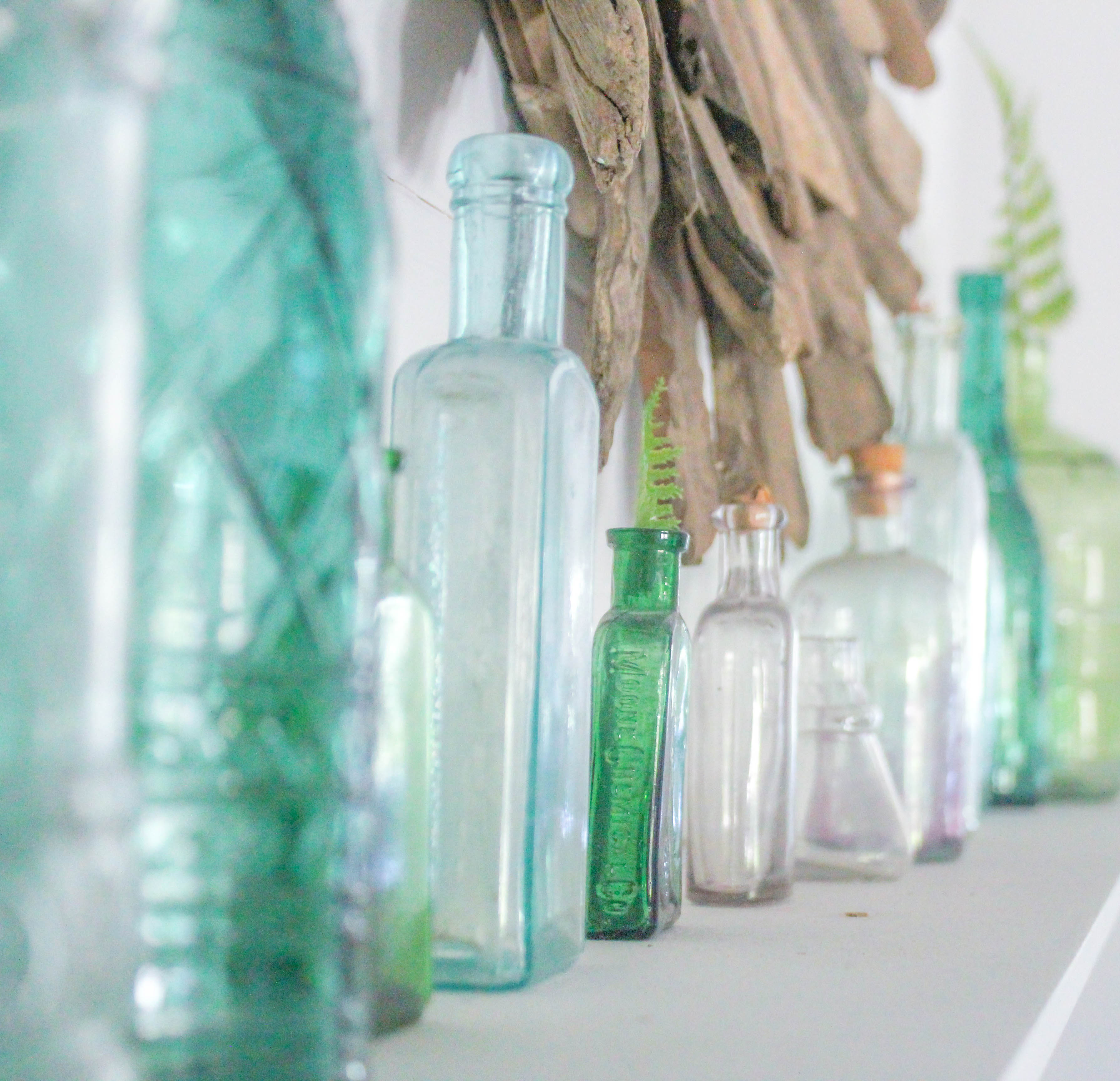 Glass Bottles on Mantel